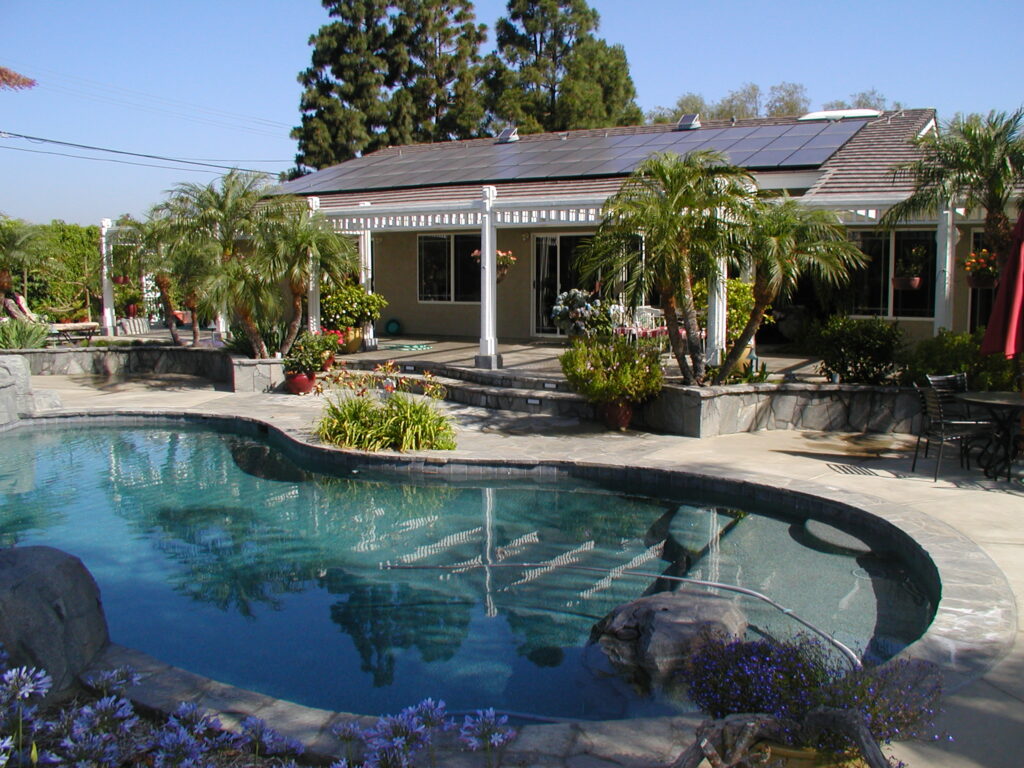 image house with pool and solar panels