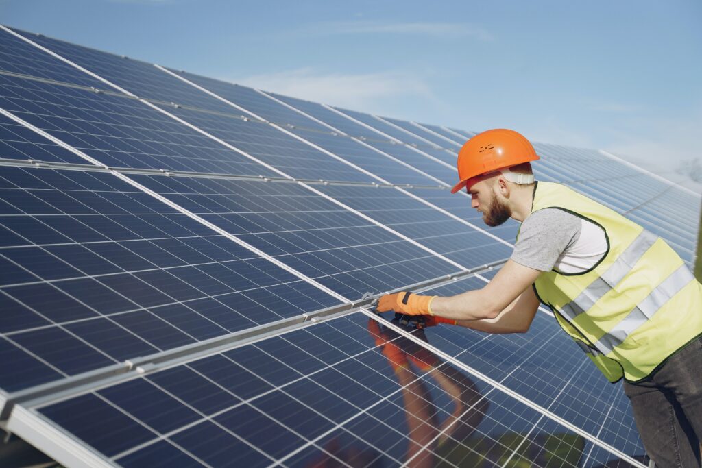 technician installing solar panels